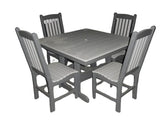 Elegant outdoor dining set with four matching chairs and a square table, crafted from weather-resistant poly lumber in a black and tan finish.